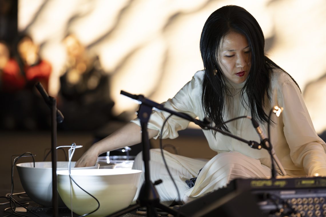 Waterbowls. Sound performance by Tomoko Sauvage, 2025 Courtesy Pirelli HangarBicocca Photo Lorenzo Palmieri