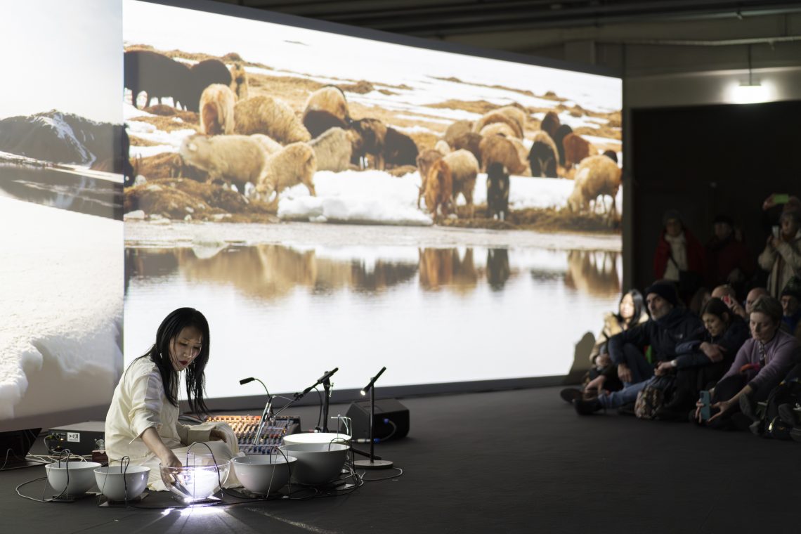 Waterbowls. Sound performance by Tomoko Sauvage, 2025 Courtesy Pirelli HangarBicocca Photo Lorenzo Palmieri